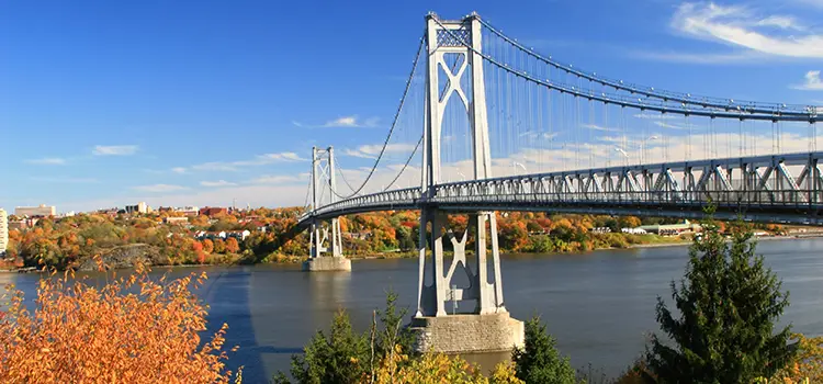 A photo of the Poughkeepsie bridge during Autumn.